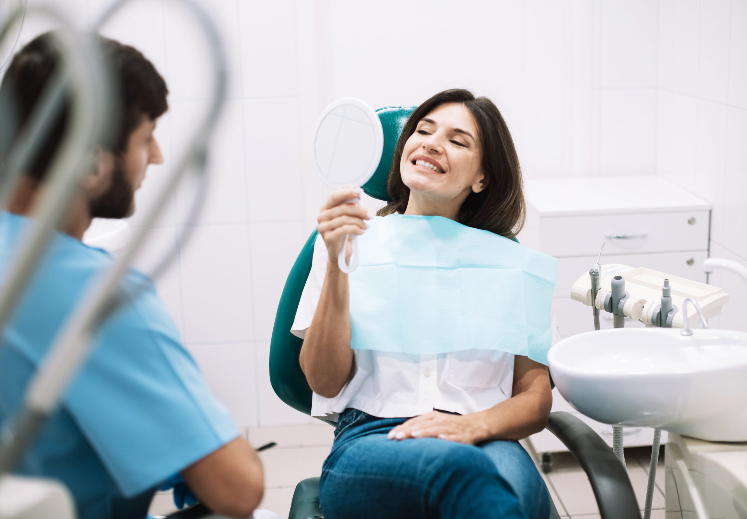 Smiling patient receiving expert care from Peekskill Prosthodontists at Rosen Prosthodontics, showcasing advanced dental treatments and personalized care in a welcoming environment.